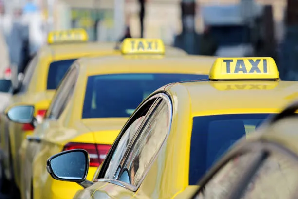 Fleet of yellow taxi cars ready for service